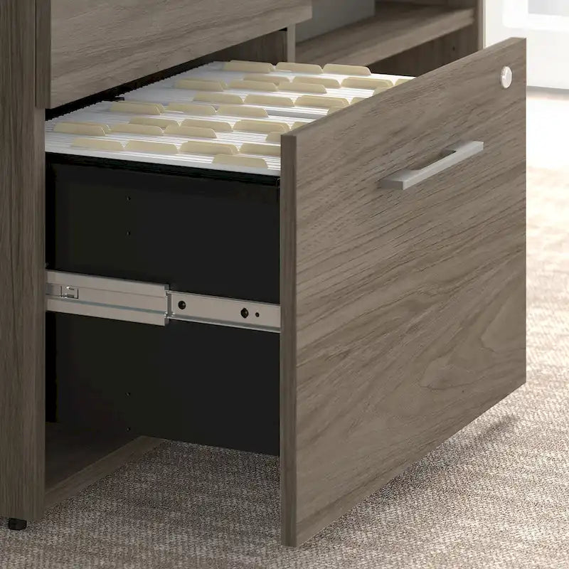 Meuble de rangement bas de bureau gris orageux à deux tiroirs, avec serrures et étagères ouvertes, support d'imprimante.
